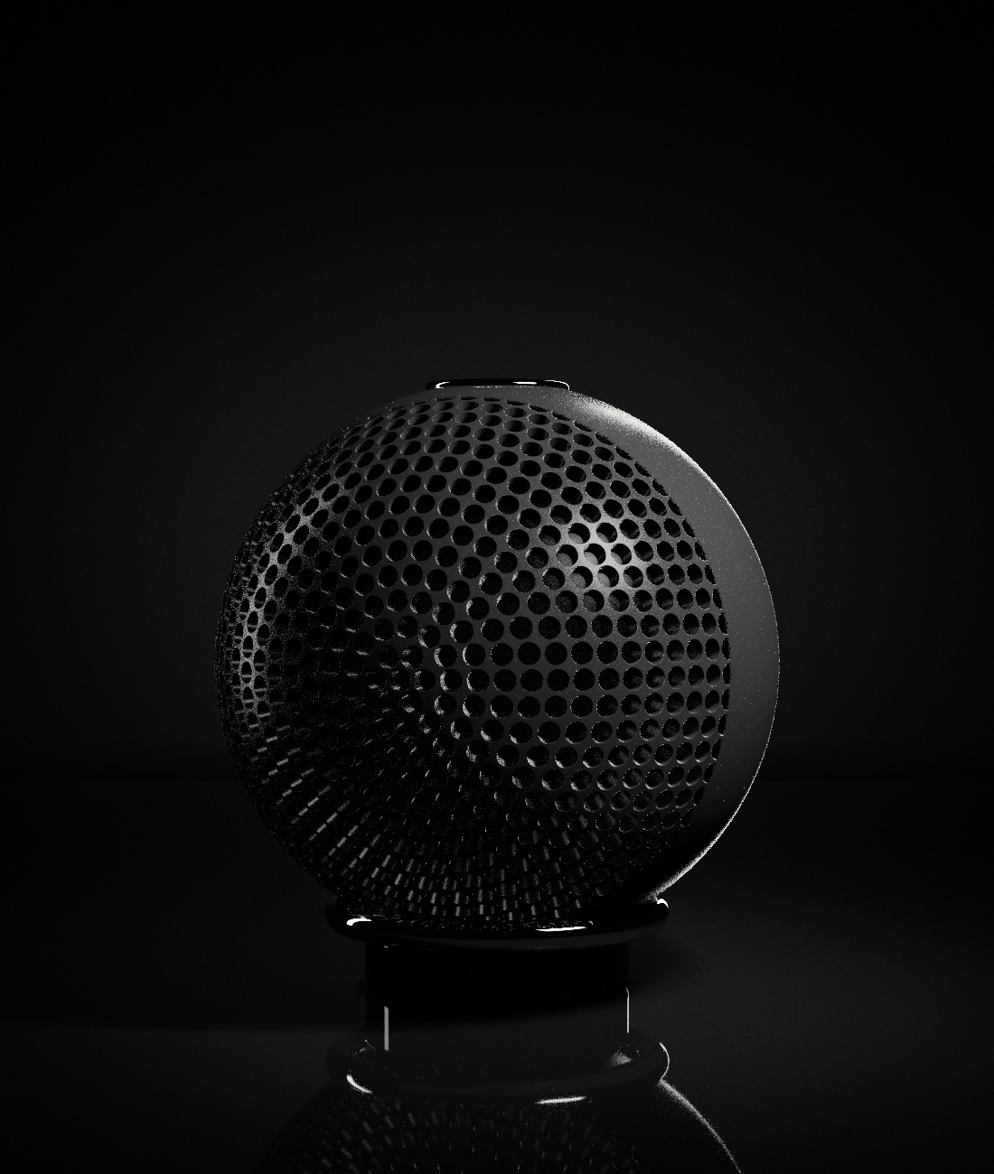 Spherical speaker with a perforated grille in a chrome ring stand